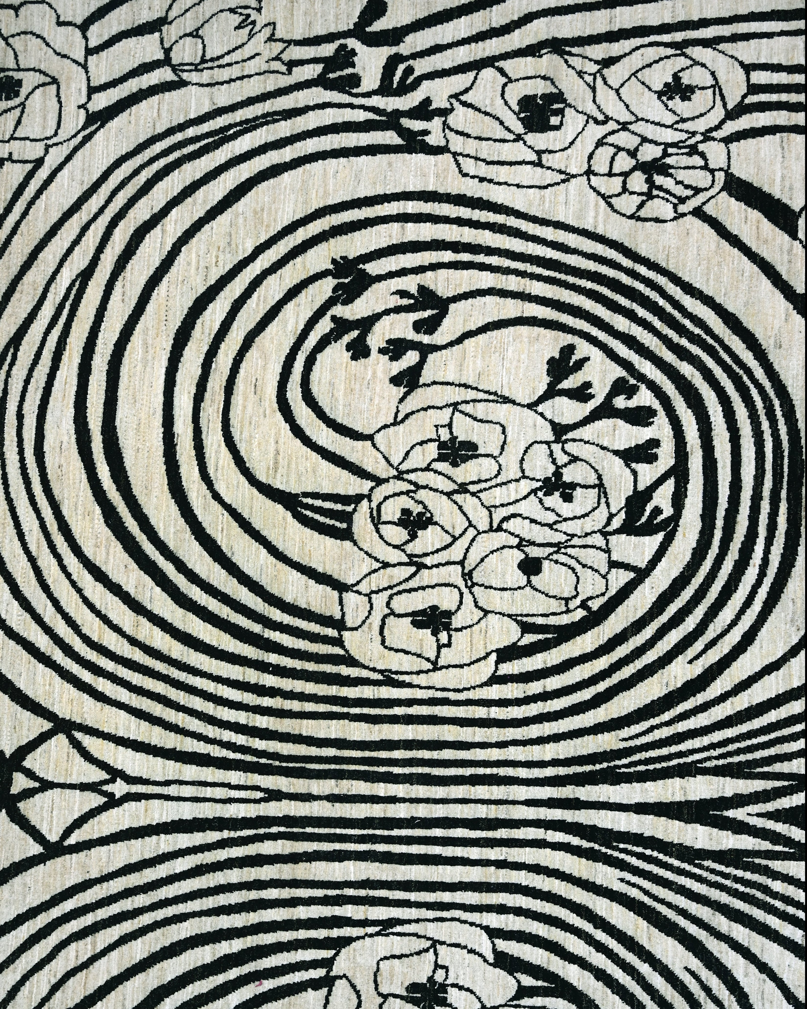 Decorative rug with floral patterns and concentric circles on a beige background