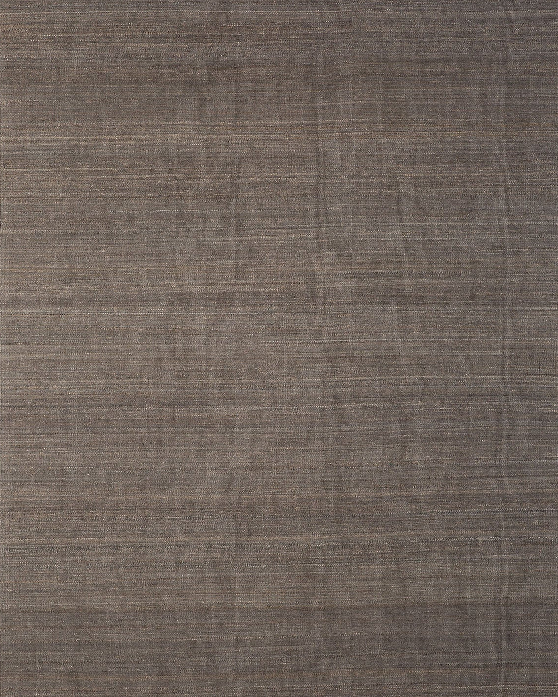 A flatweave kilim rug in a gray color with a textured surface.