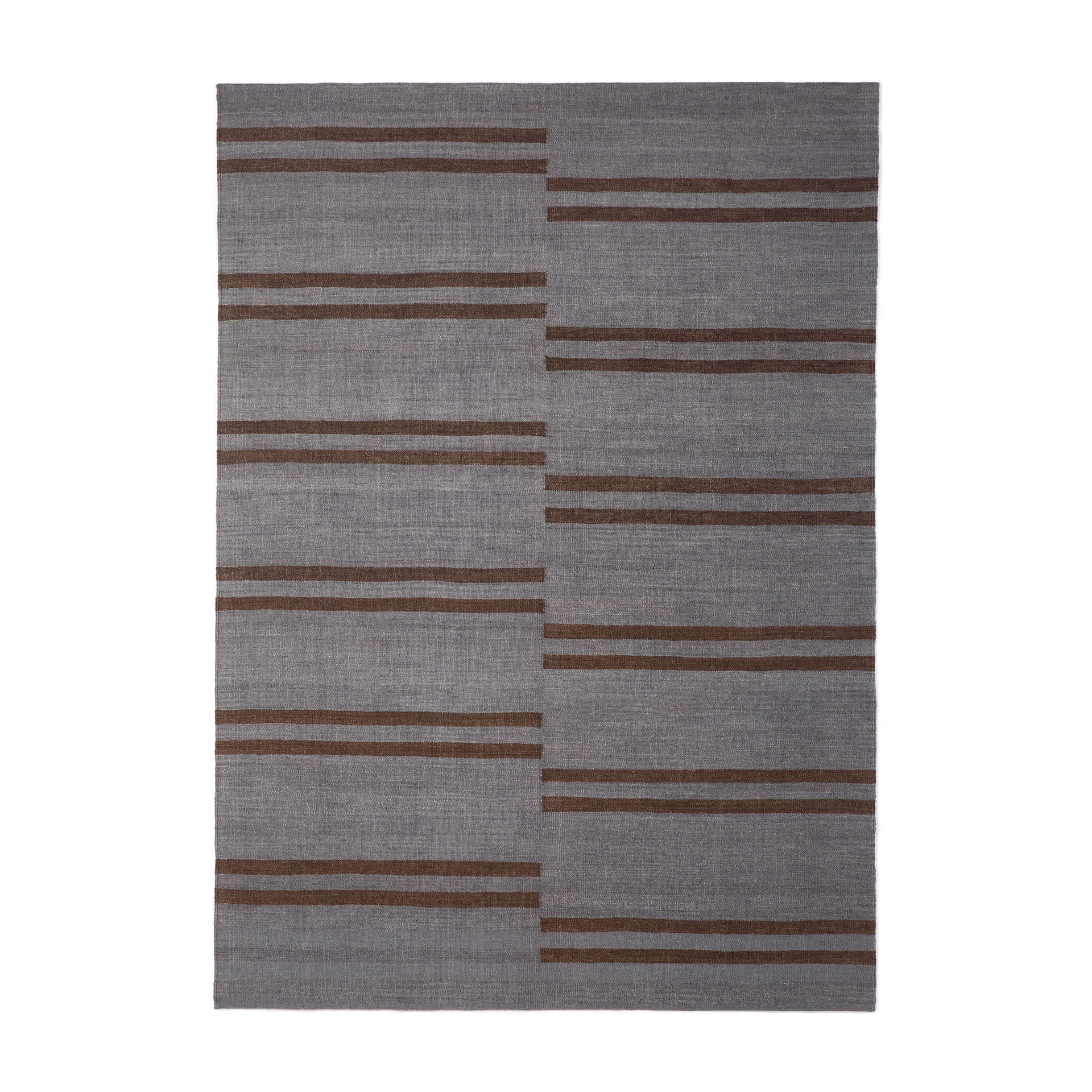 A rectangular kilim rug with a striped pattern in shades of gray and brown.