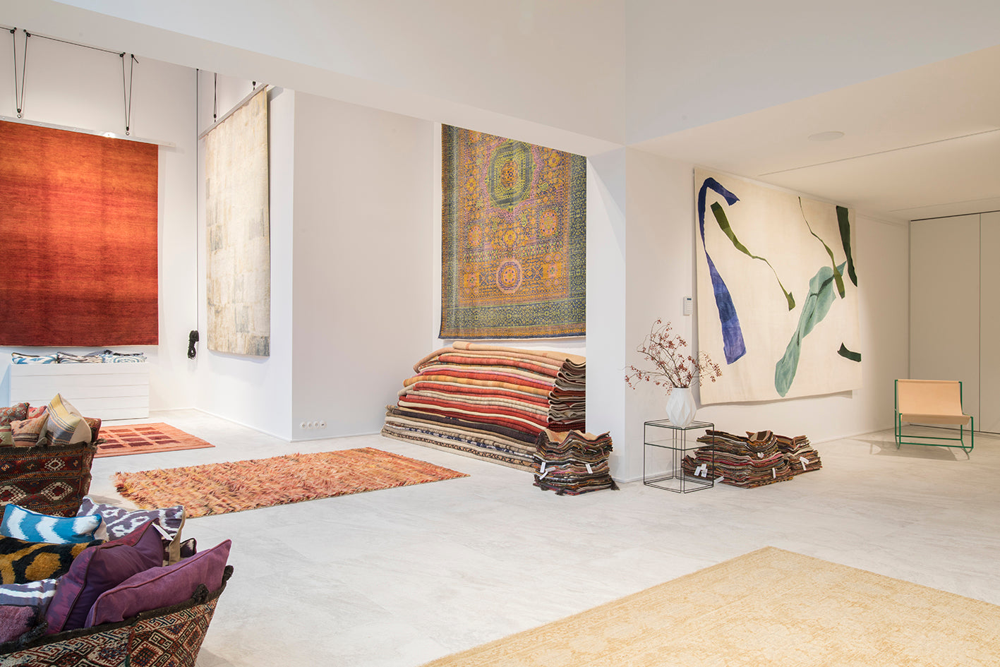 Exclusive design rugs on display at Ashtari Carpets showroom in Antwerp