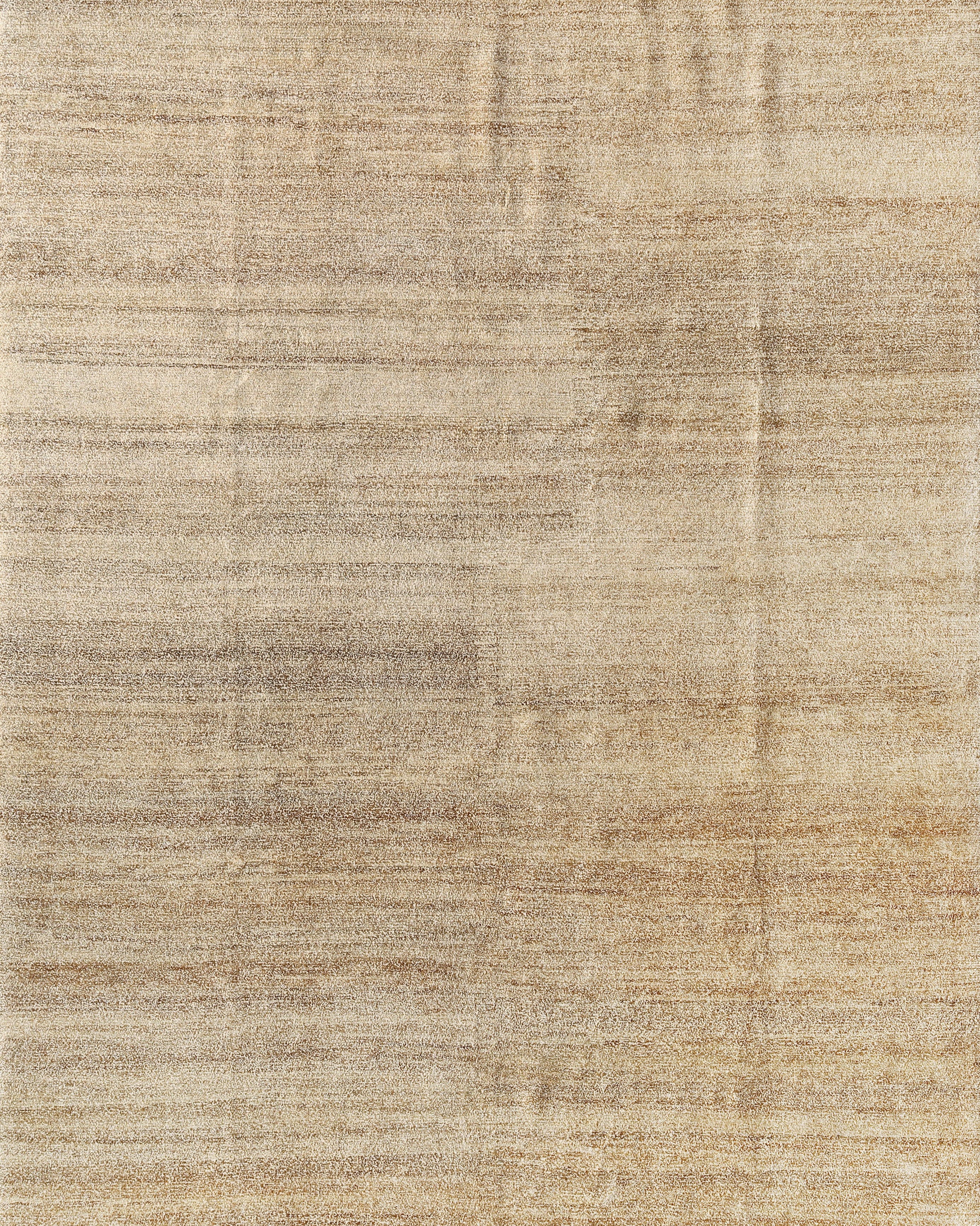 A beige and brown traditional handwoven rug made from natural fibers, displaying a subtle geometric pattern.