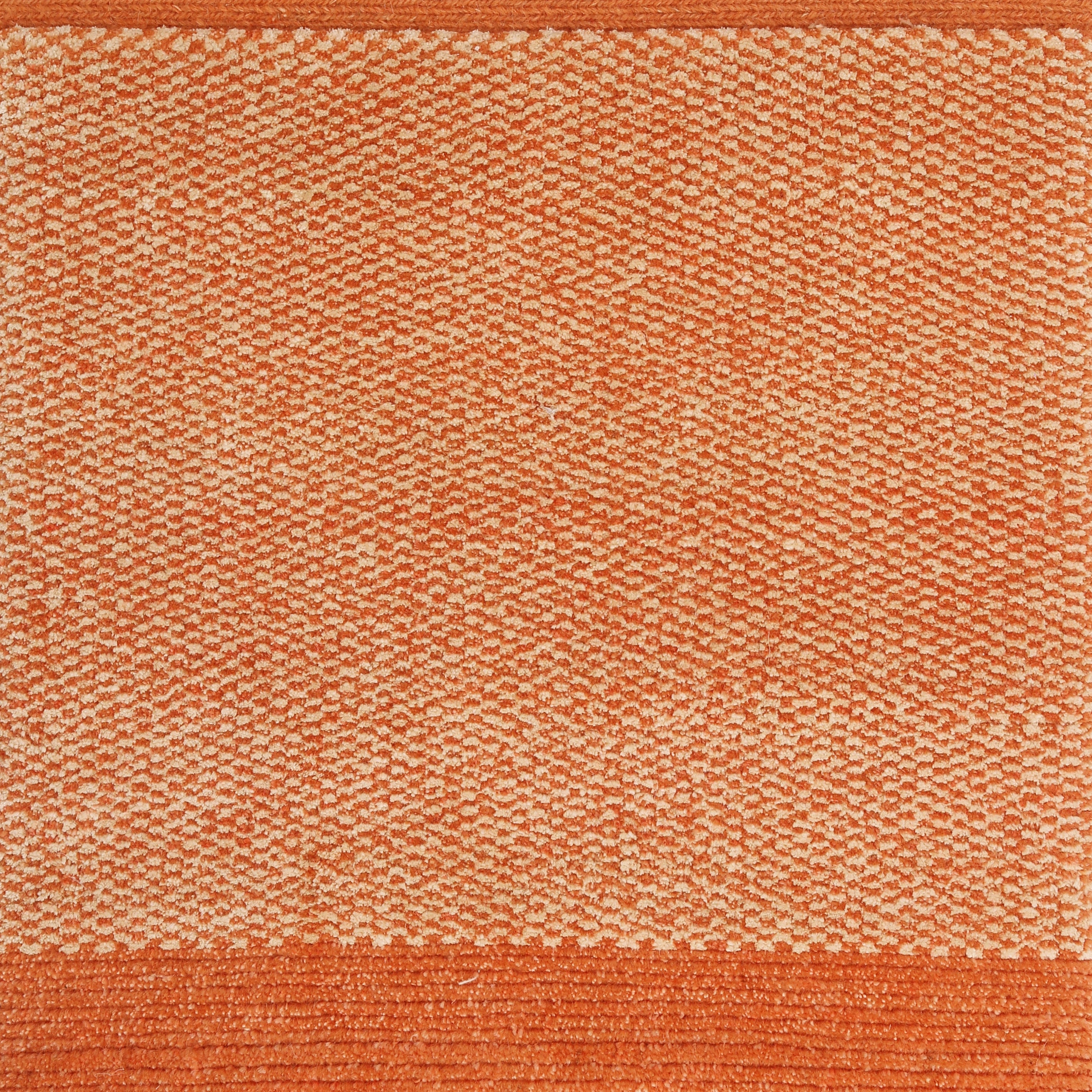 An orange textured rug with a solid color and a small pattern at the bottom.