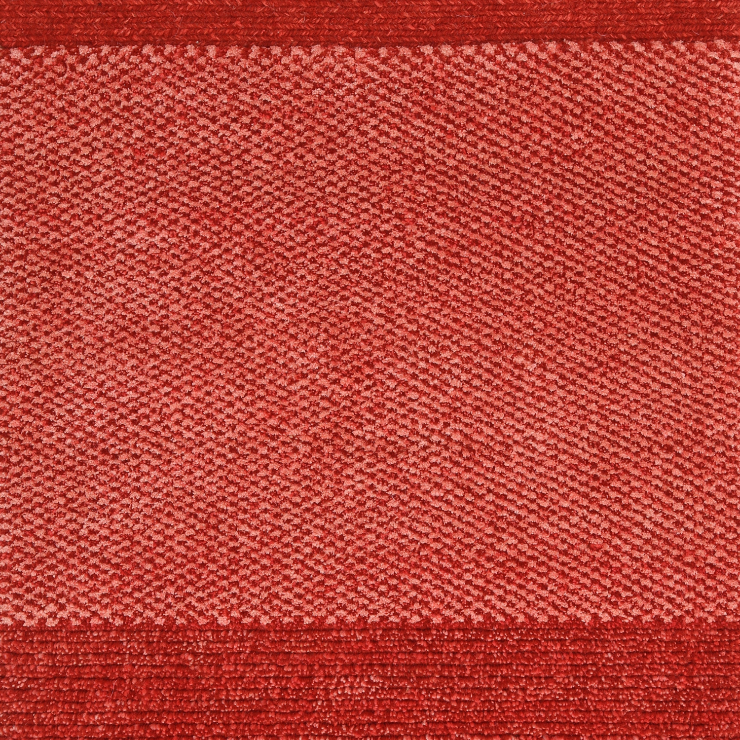 A red carpet sample with a textured pattern chromatic red architecturals damboord rug tapijt