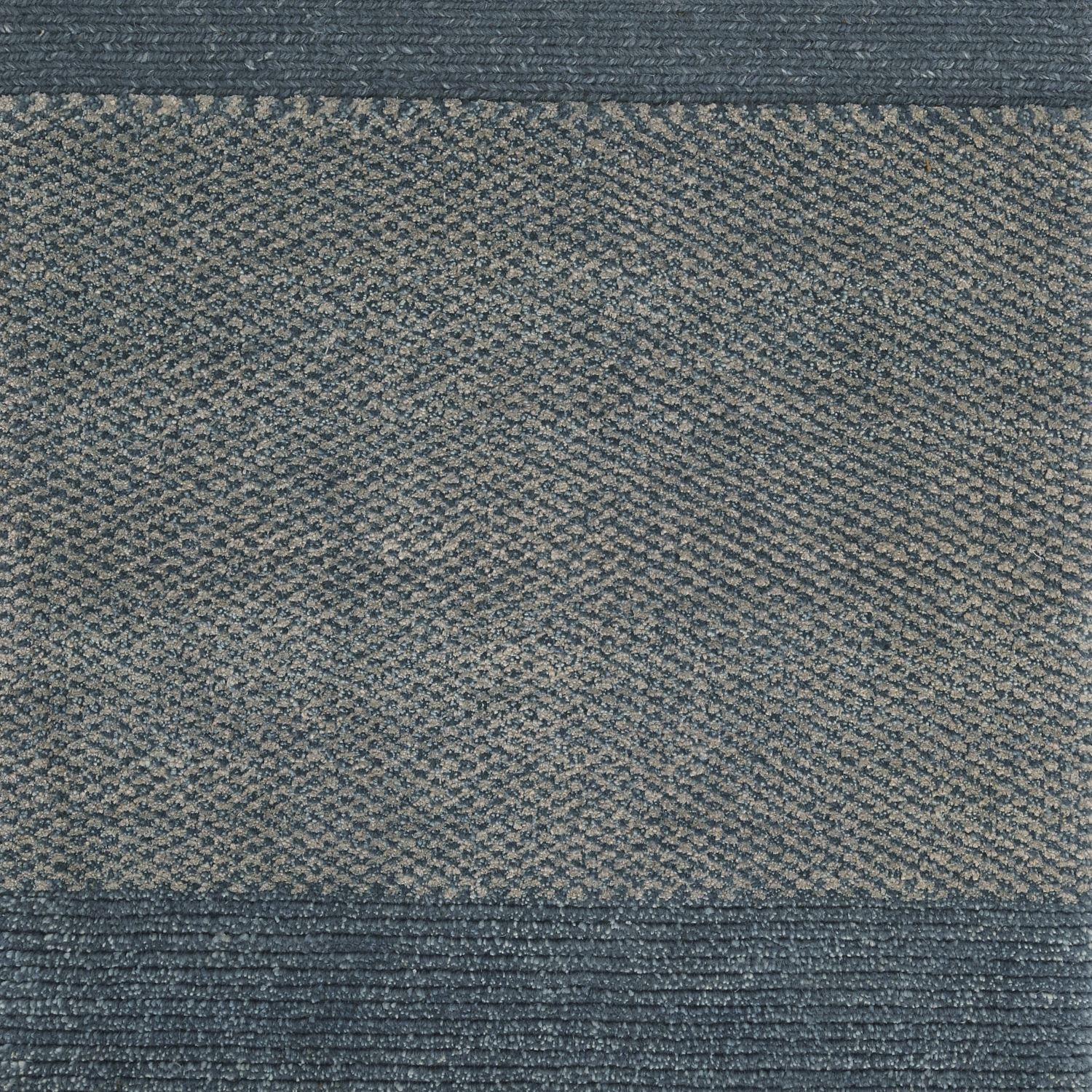A rectangular carpet sample with a soft blue color and a textured pattern. architecturals