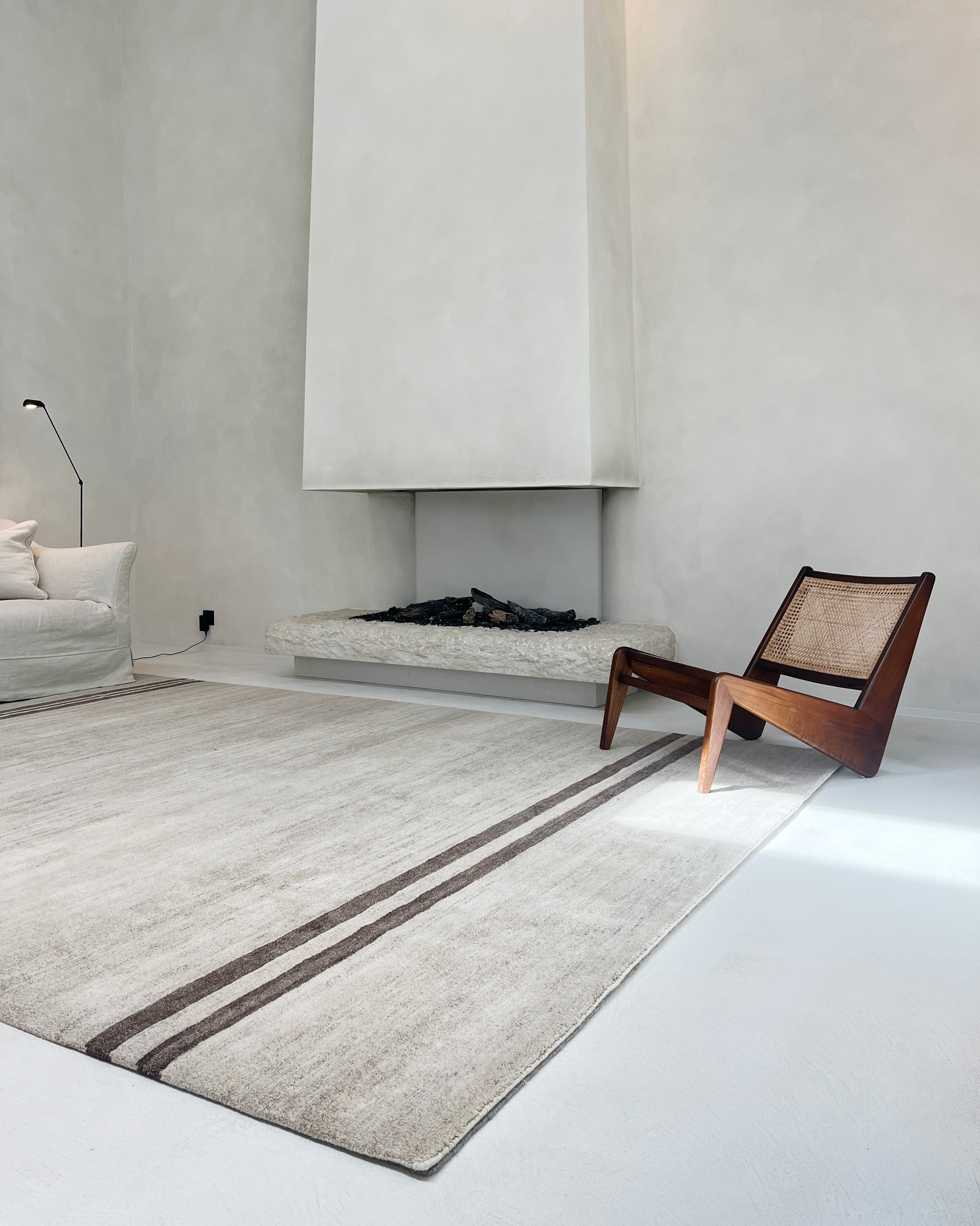 Exclusive handmade design rug "Sand Dunes" in a modern living room