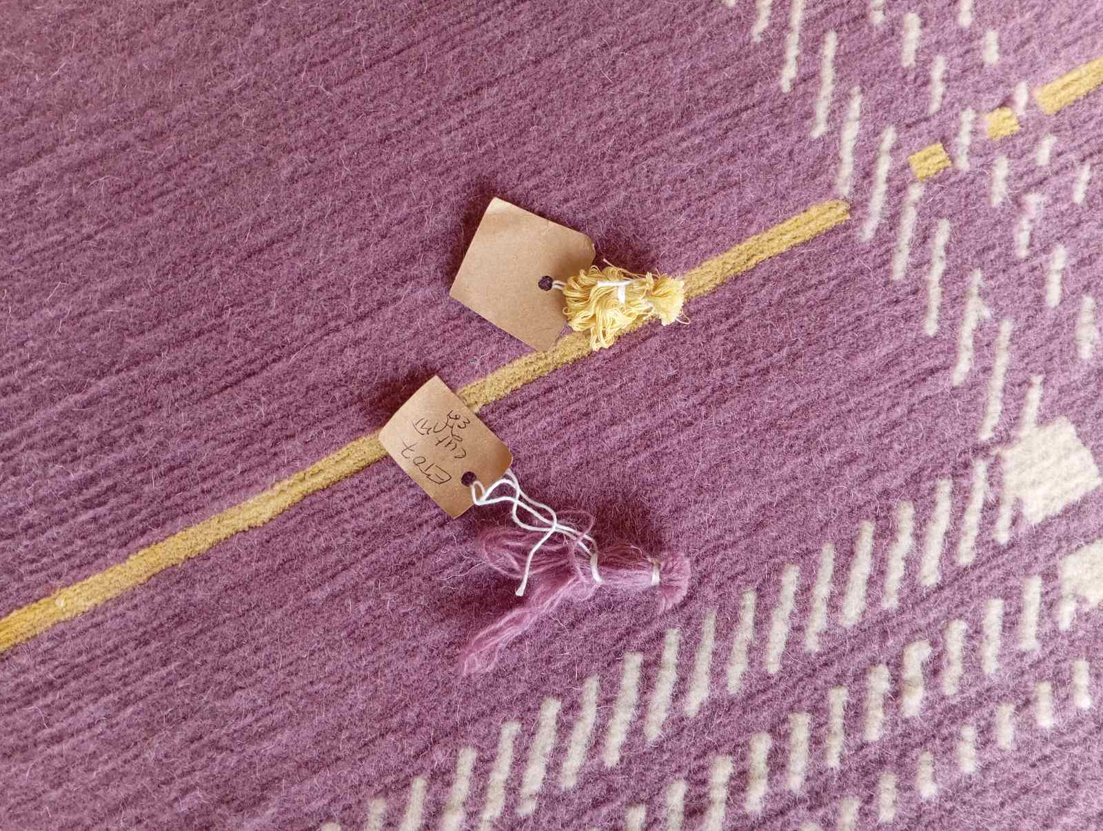 Close-up of handmade design rug texture highlighting sustainable craftsmanship and luxury details.