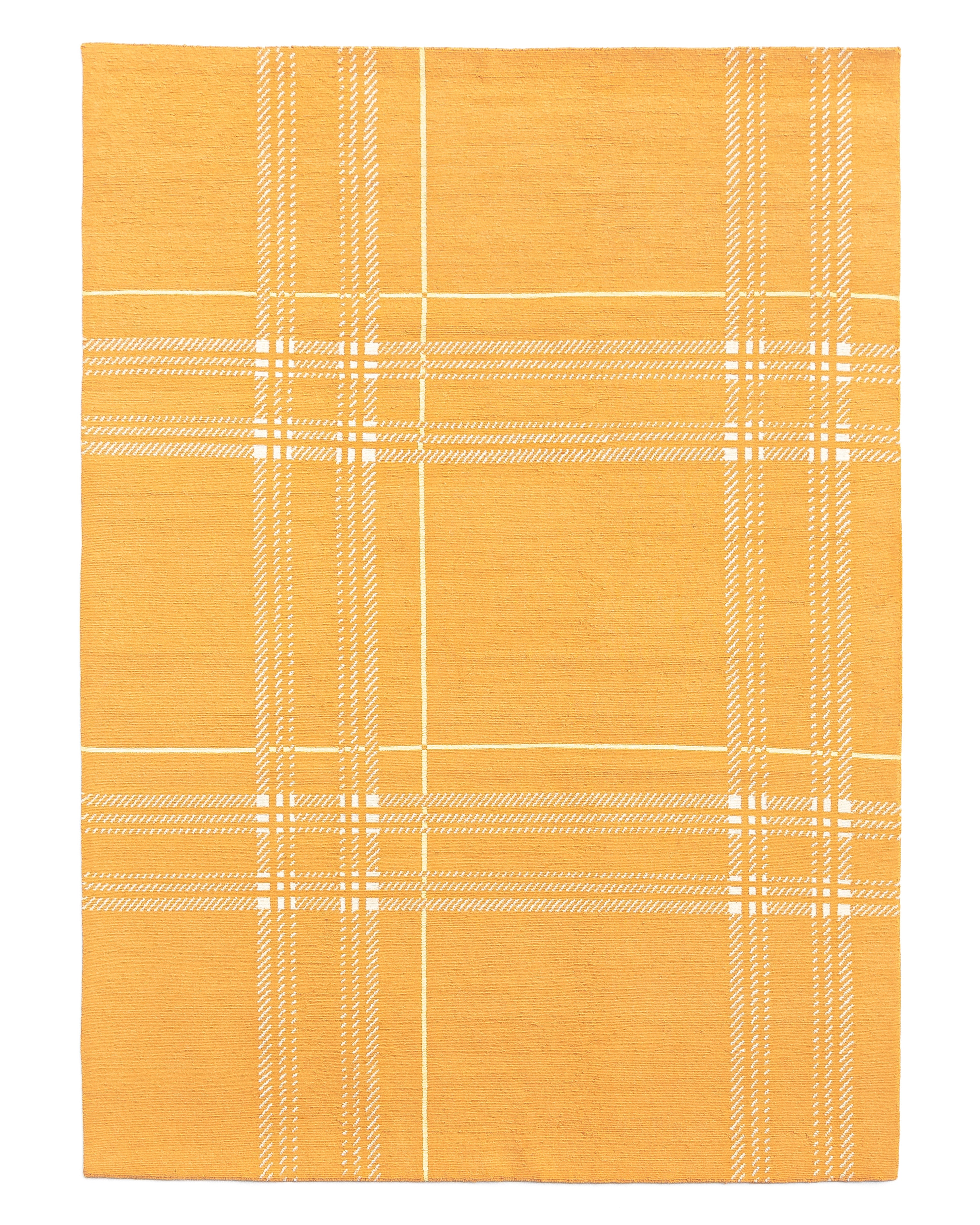 Léon Stynen écossais rug collection – handcrafted Tibetan wool and silk rugs with refined checkered design inspired by Antwerp archives.
