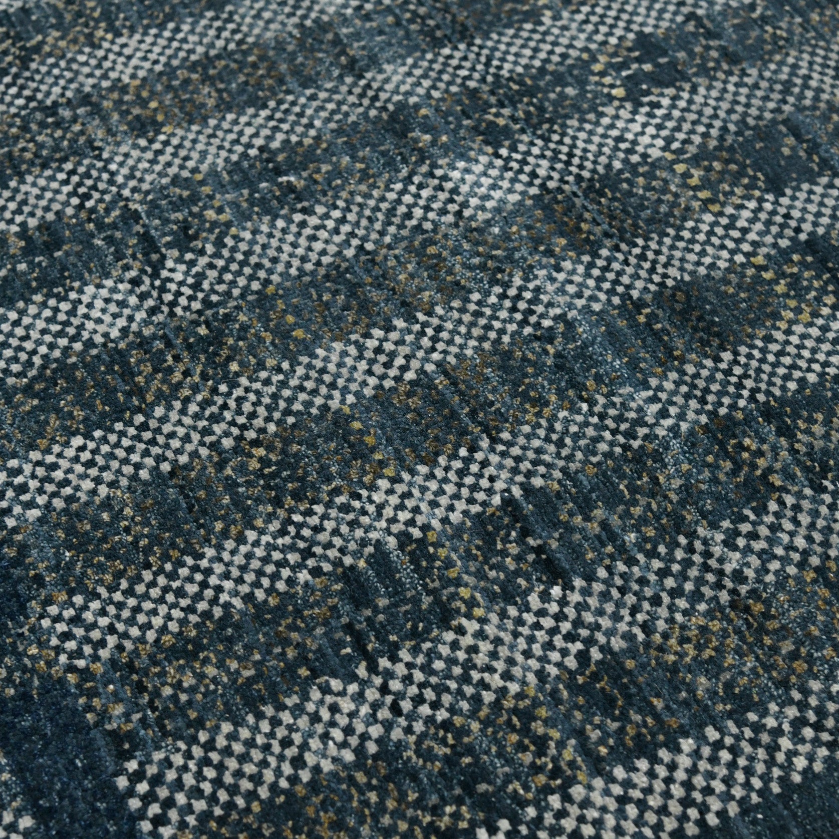 Close-up of a textured fabric with a blue and white checkered pattern