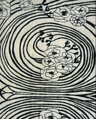 Decorative rug with floral patterns and concentric circles on a beige background