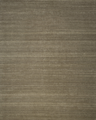 A flatweave kilim rug in a neutral color, displaying the texture and weave of the fibers.