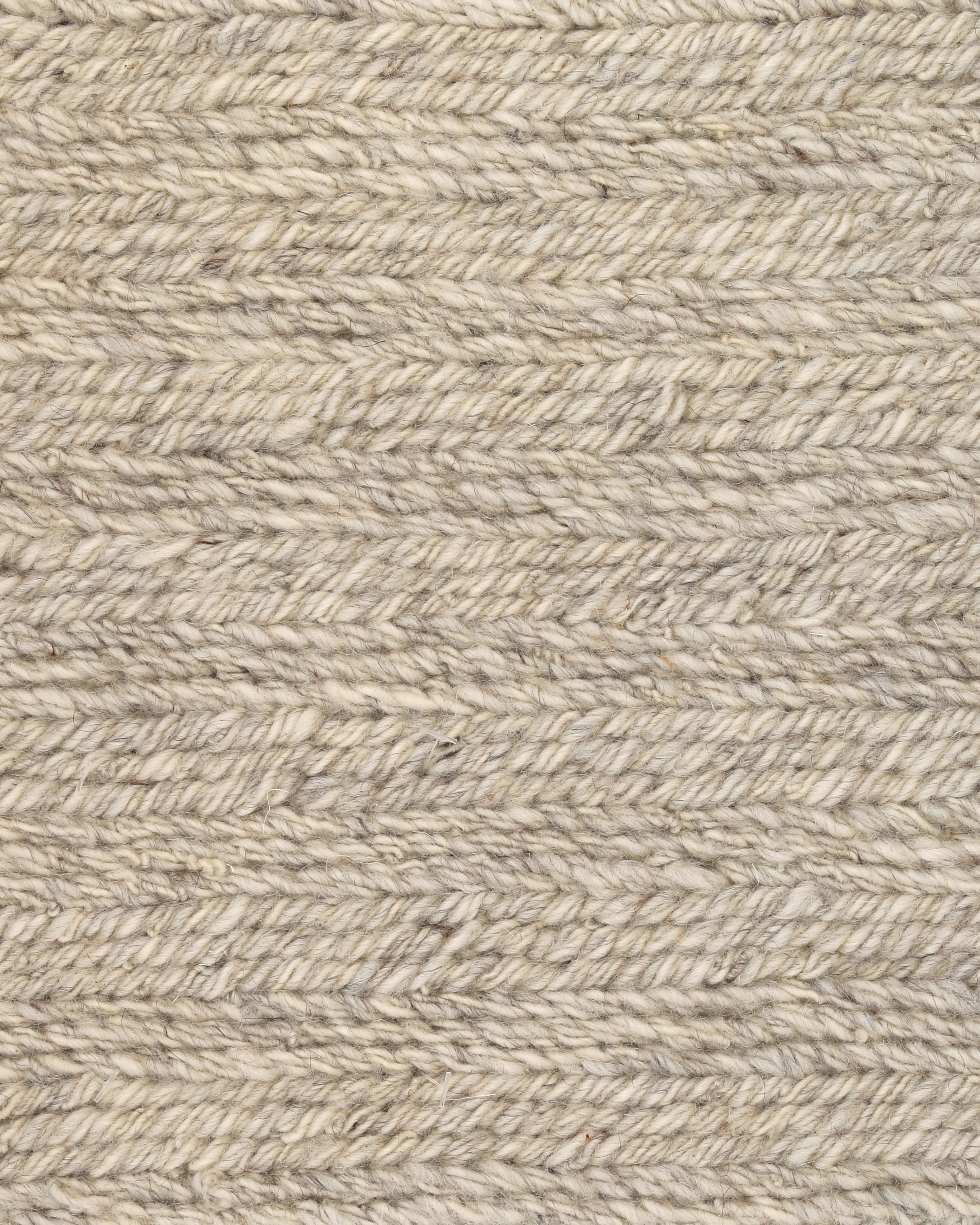 A woven textile in ivory color with a textured pattern, likely a sample for a rug or fabric.