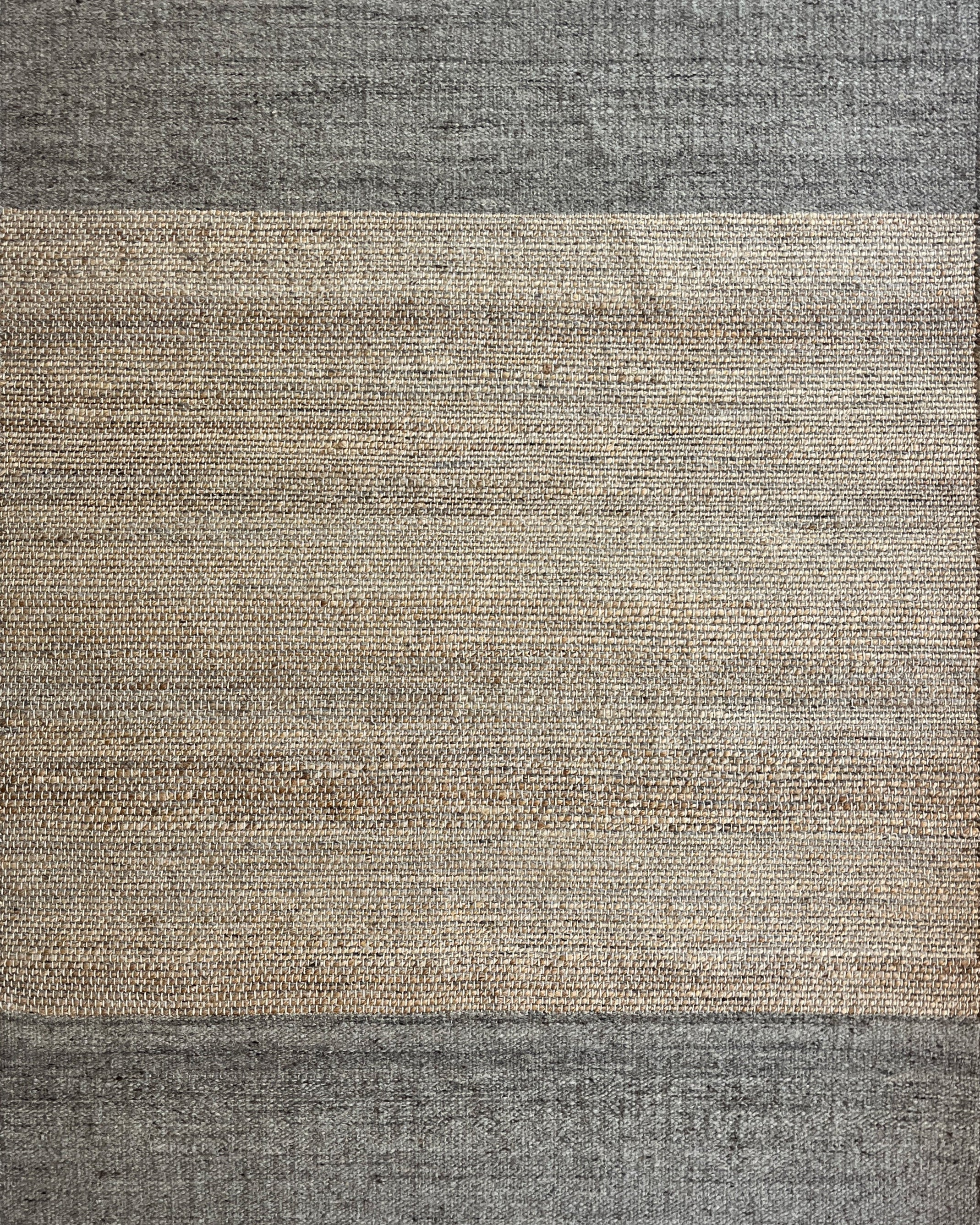 Rectangular rug with two-tone design on a white background