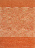 An orange textured rug with a solid color and a small pattern at the bottom.