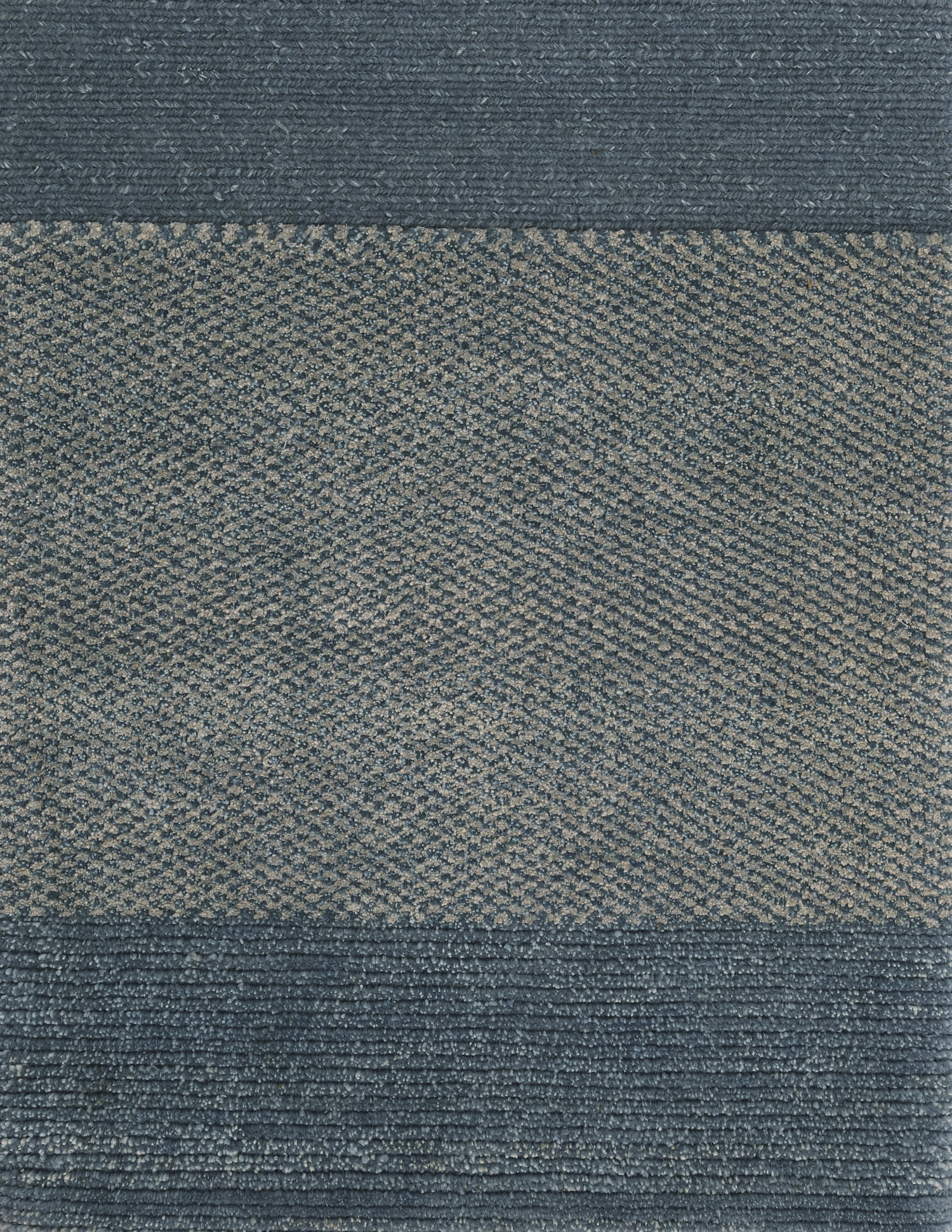 A rectangular carpet sample with a soft blue color and a textured pattern. architecturals