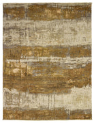 Abstract patterned rug with brown, beige, and white colors on a plain background