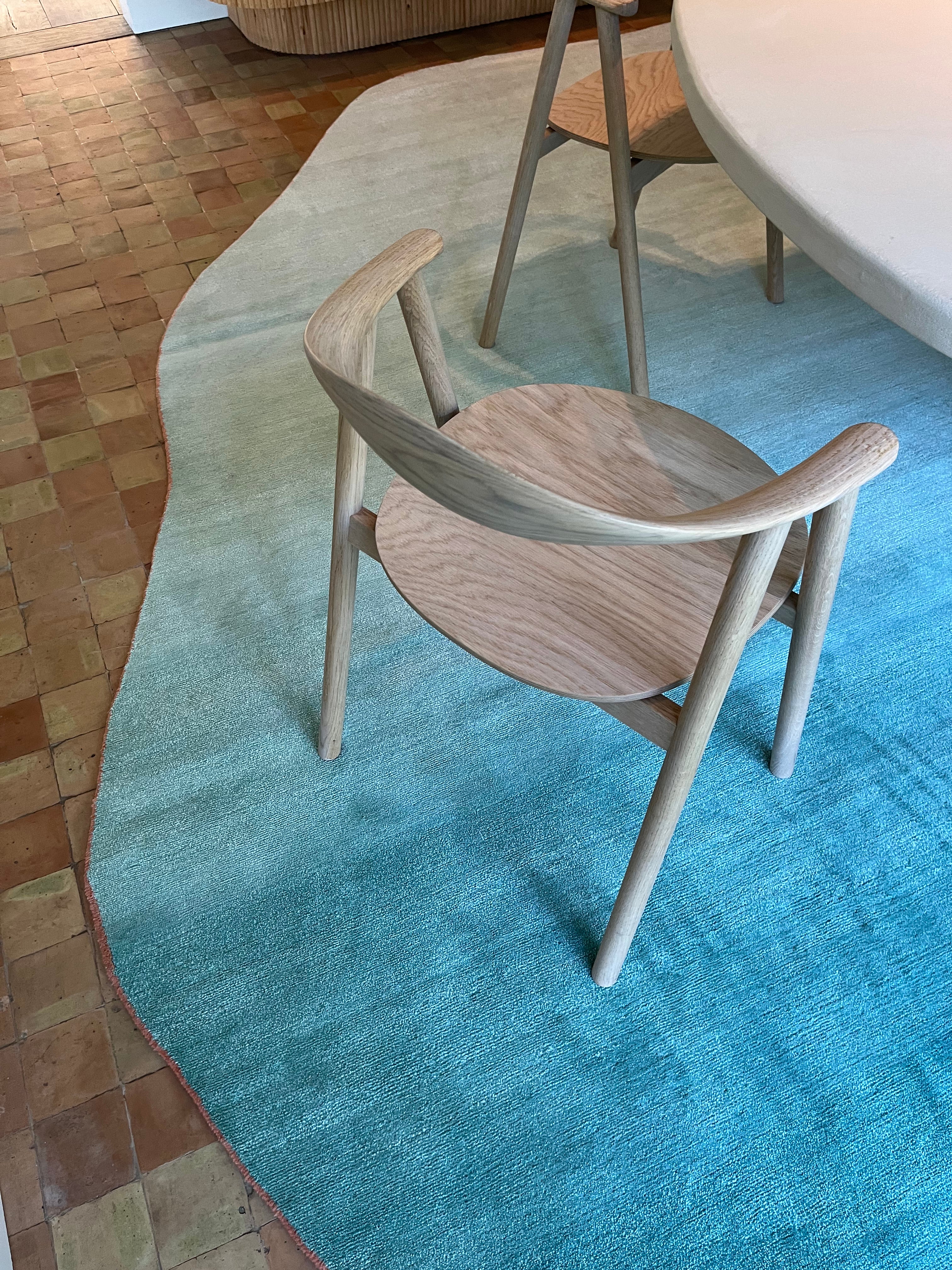 Close-up of a bespoke organic rug showing fine texture, soft gradient colors, and handcrafted finish.