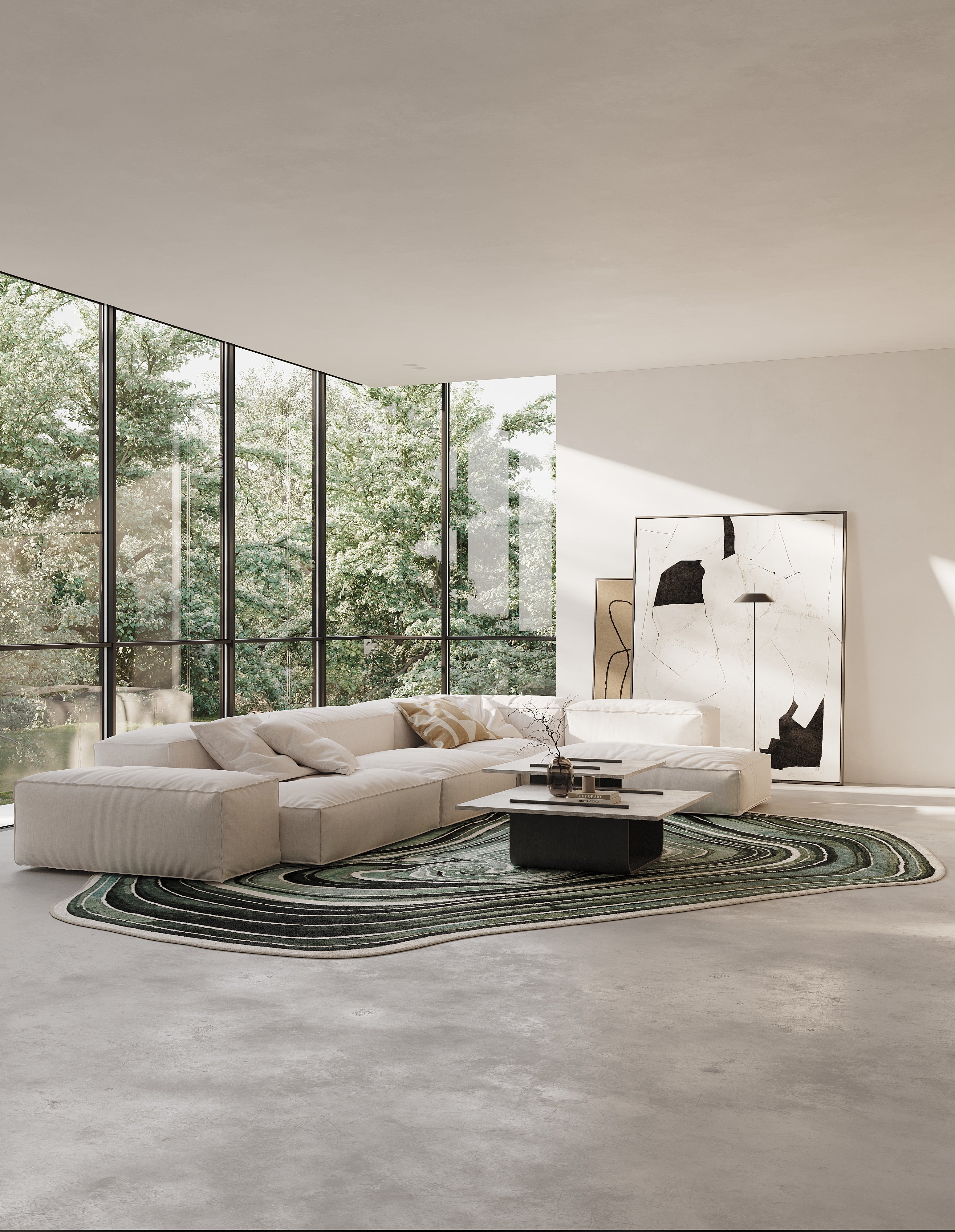 Modern living room with a large sectional sofa, round coffee table, and floor-to-ceiling windows.