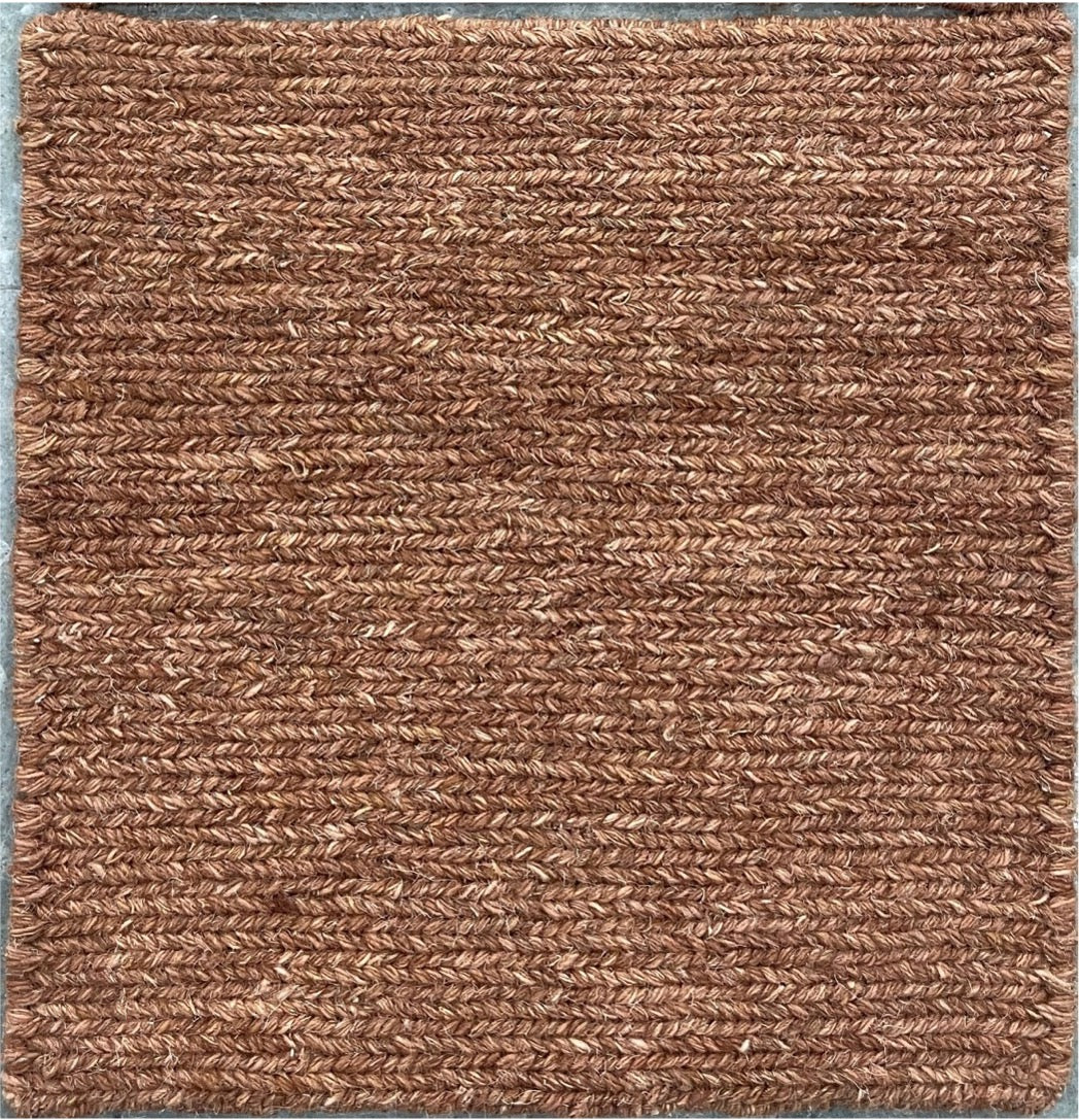 Brown textured doormat with a woven pattern
