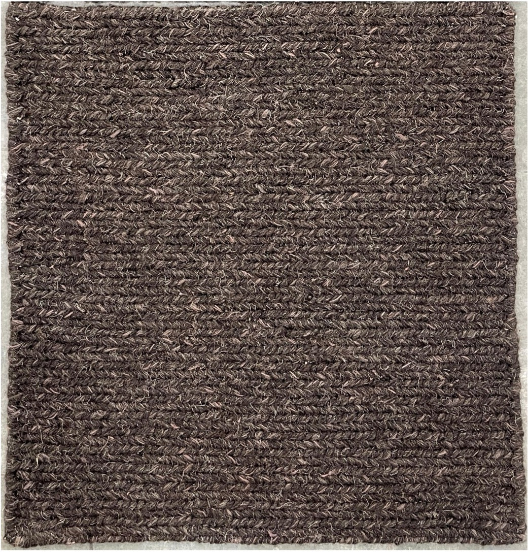 Brown textured rug on a plain background