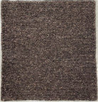 Brown textured rug on a plain background