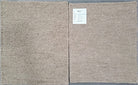 Two samples of textured beige fabric on a gray background with a label.