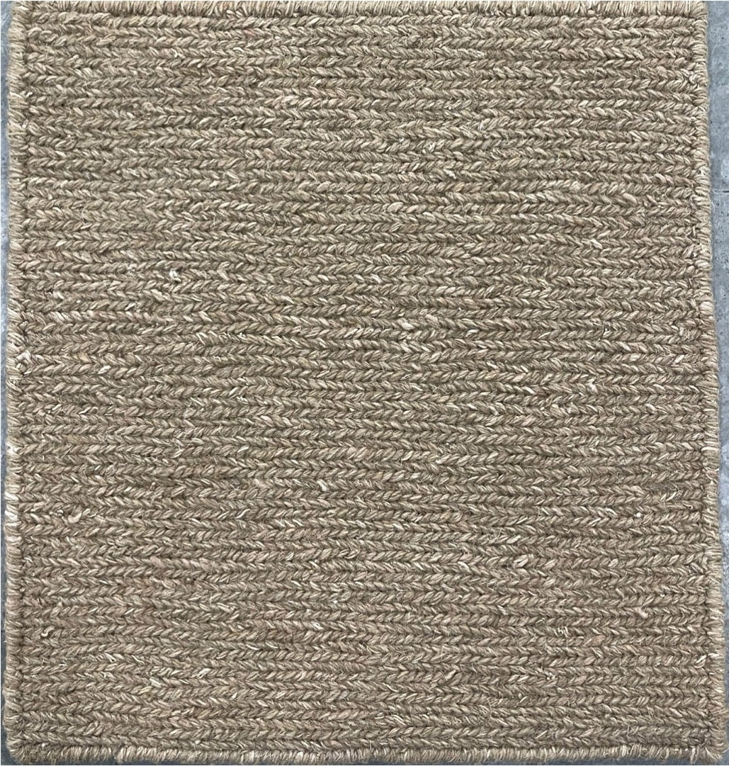 Textured brown rug with a subtle pattern