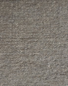 Close-up of a textured brown fabric with a waffle pattern
