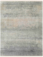 Abstract patterned rug with shades of gray, beige, and brown.