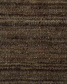 Close-up of brown textured fabric with subtle pattern